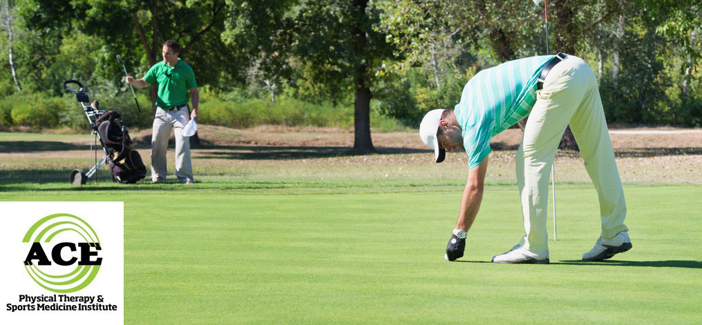 57631463 - golfer and caddy on putting green