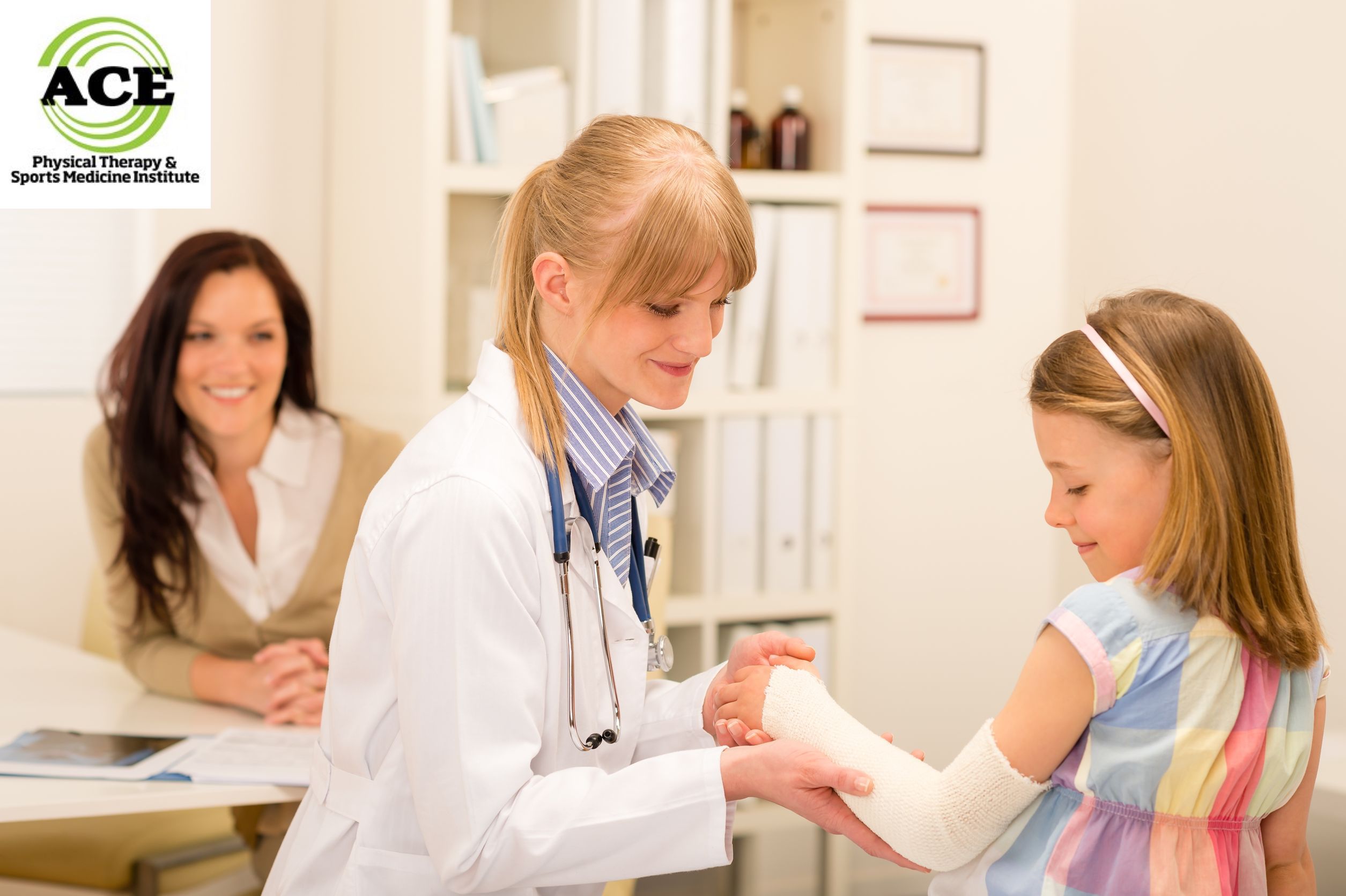 13563692 - female pediatrician checking bandage of girl broken arm